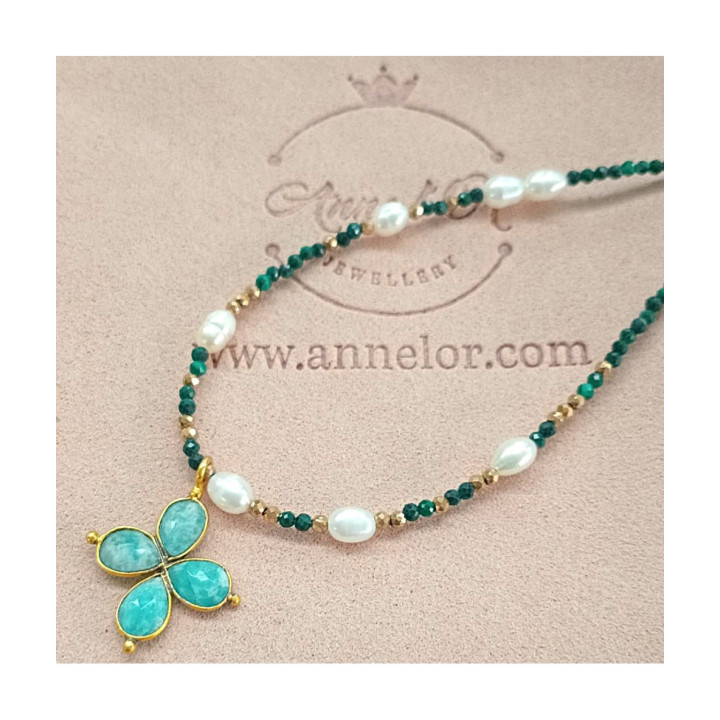 Murmures Precieux® dash and dot jewellery ‘Mère veilleuse’ necklace in malachite semi-precious stone and cultured pearls, hand-thread, with a cross pendant on its pink velvet packaging with jewellery purse
